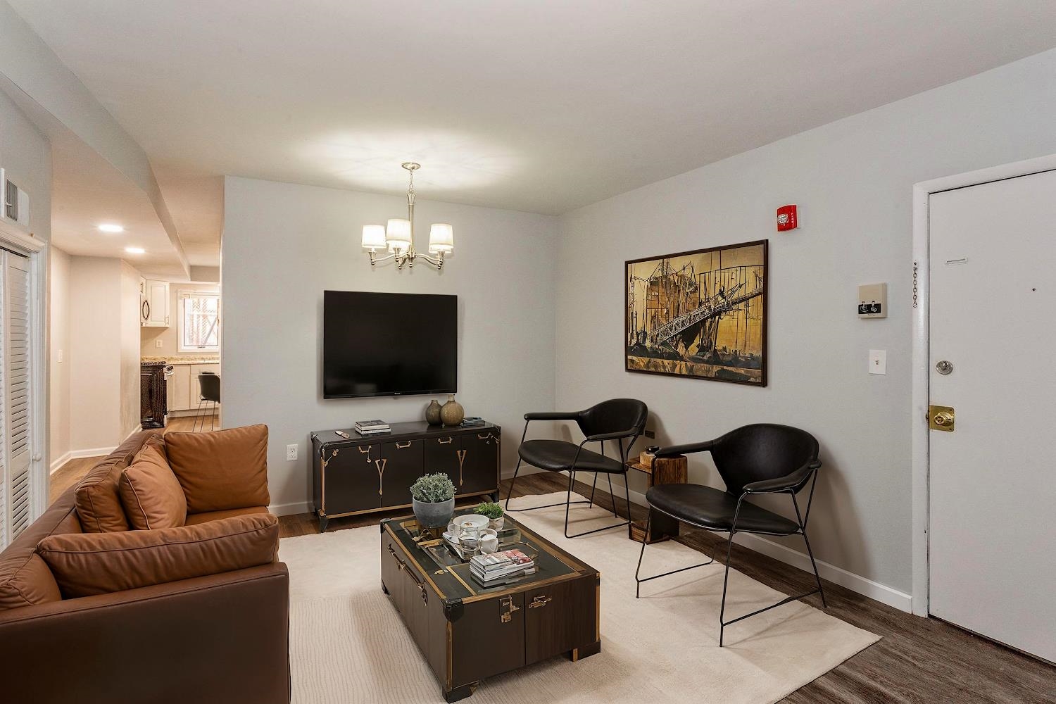 a living room with furniture and a flat screen tv