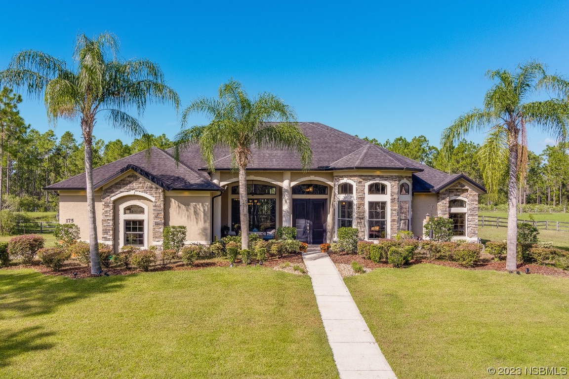 a front view of a house with swimming pool