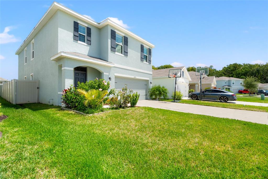 a front view of a house with a yard