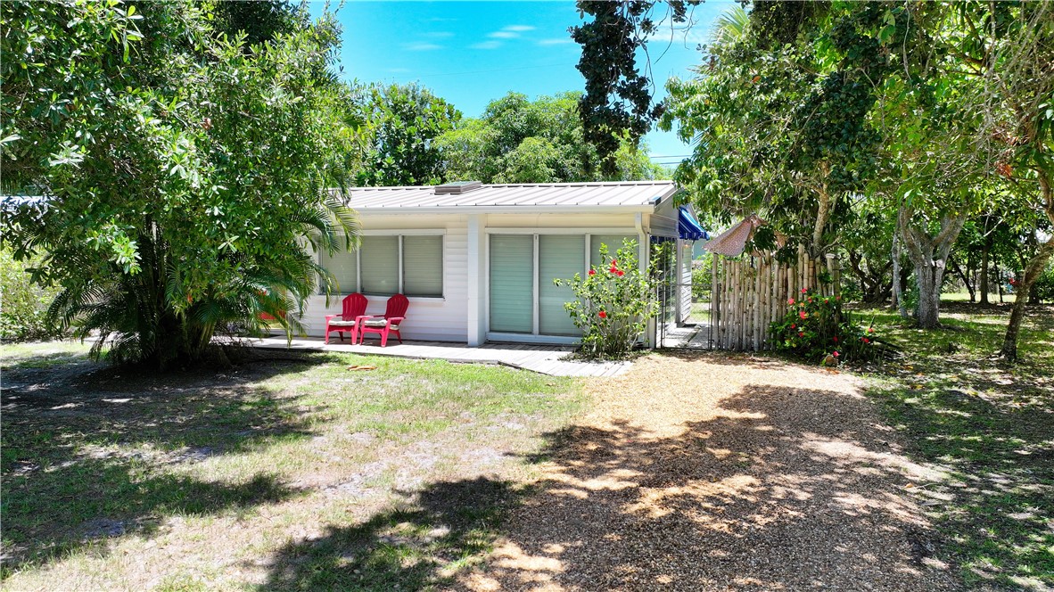 a view of a backyard with a small cabin