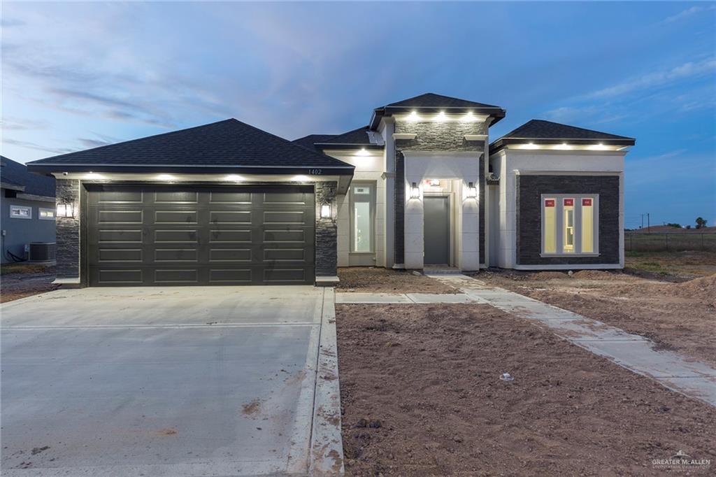 View of front of home featuring a garage