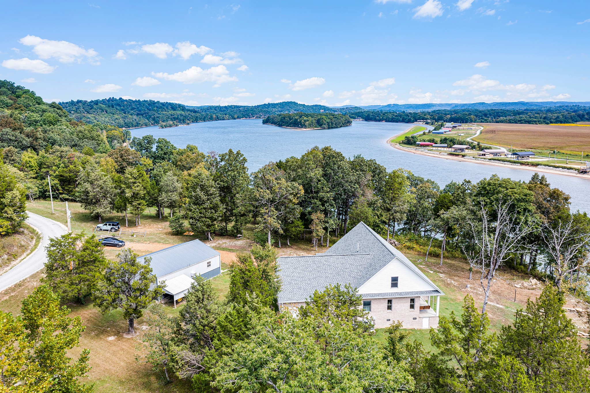 a view of a lake with houses in the back