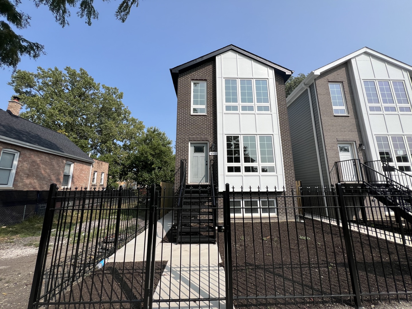 a front view of a house with a glass door