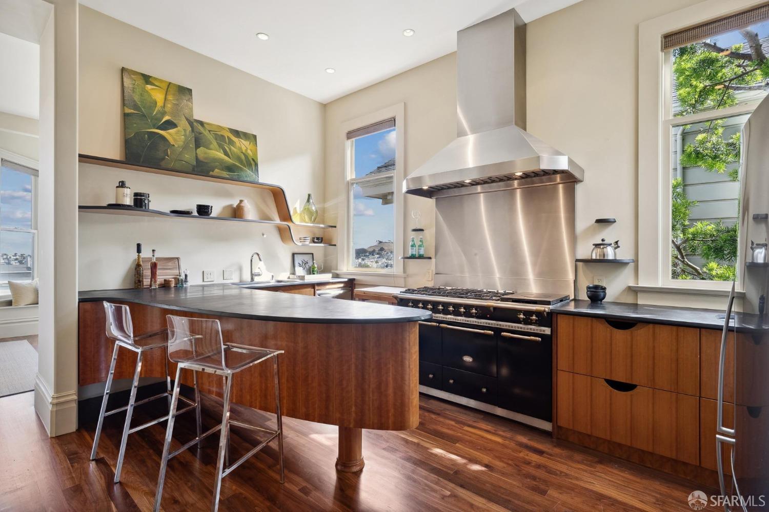 Stunning kitchen bathed with southern light in front house (one of two standalone condos on an oversized parcel)