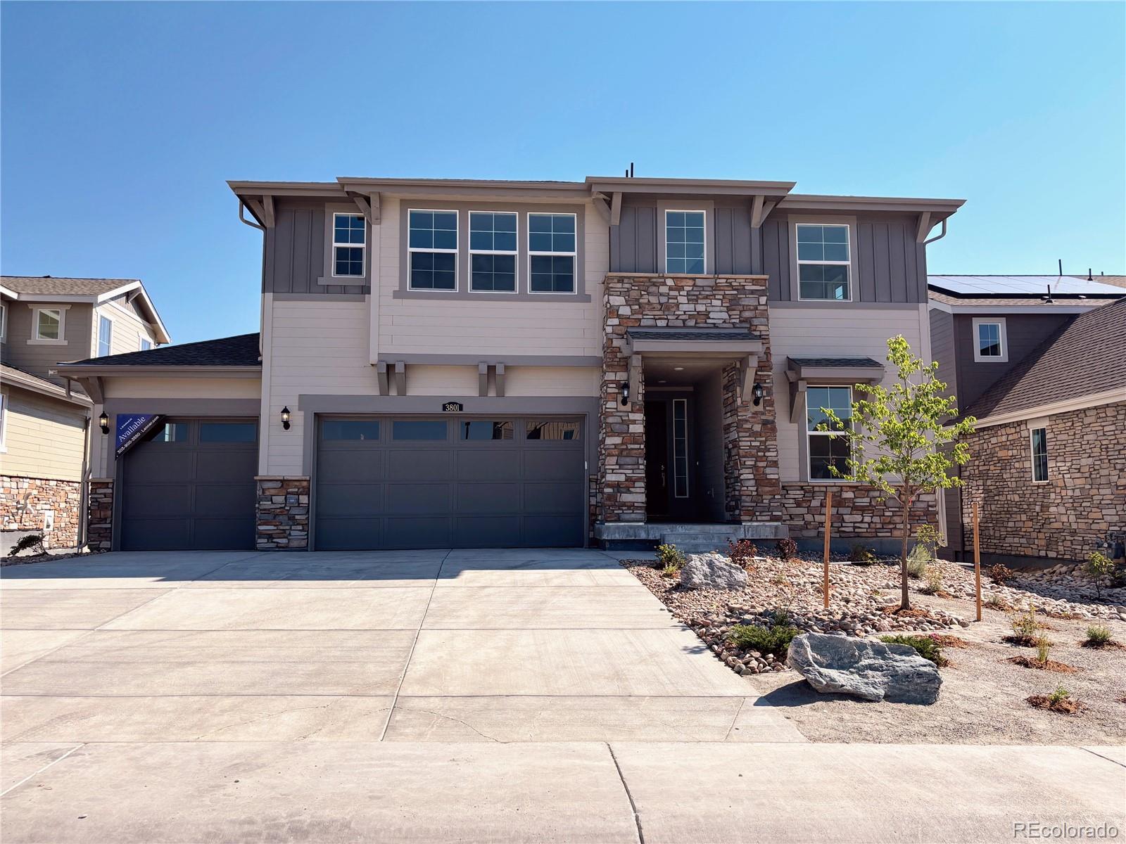 a view of a house with a yard and sitting space