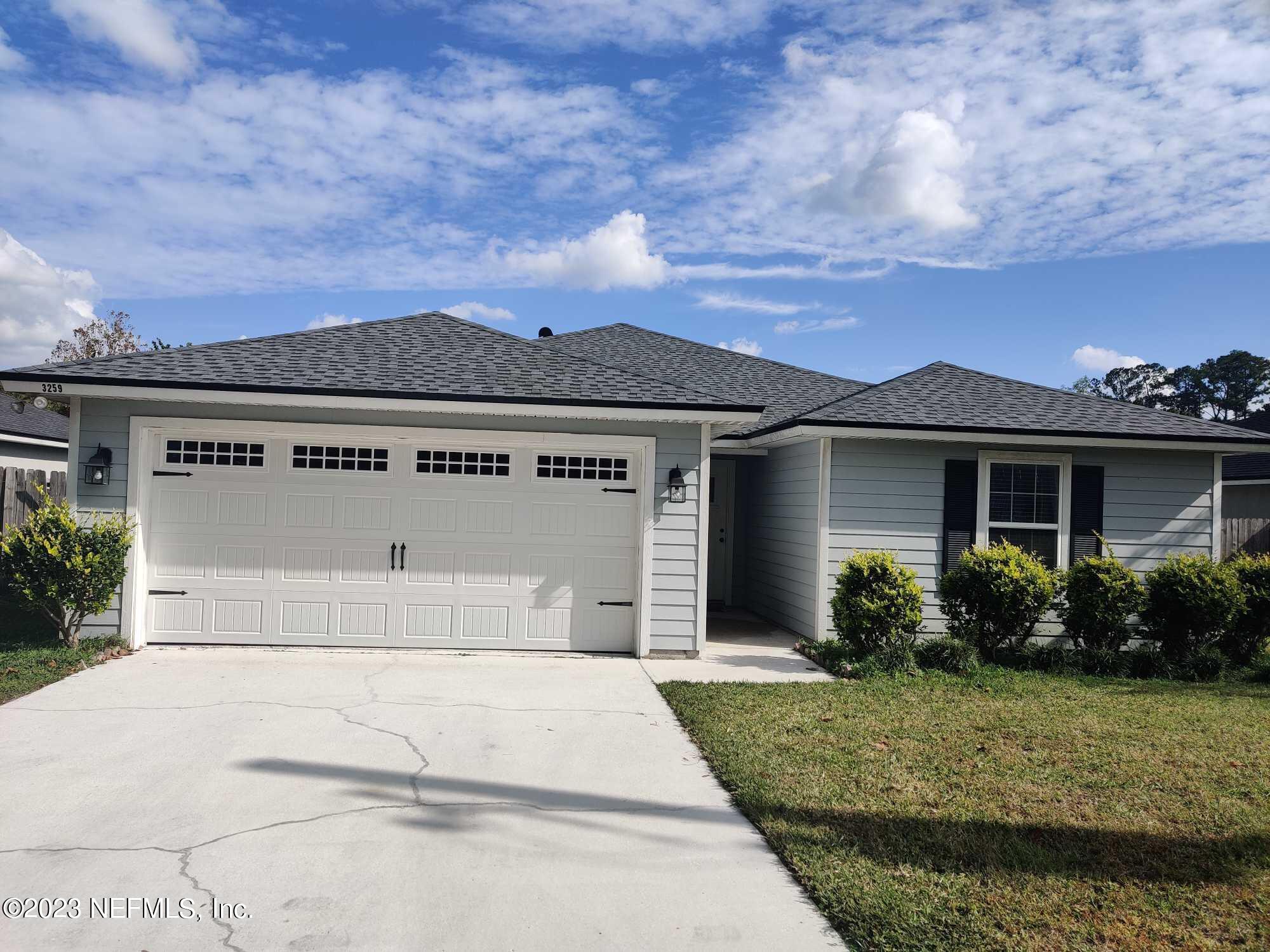 front view of a house with a yard