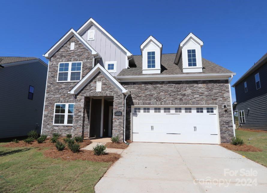 a front view of a house with yard