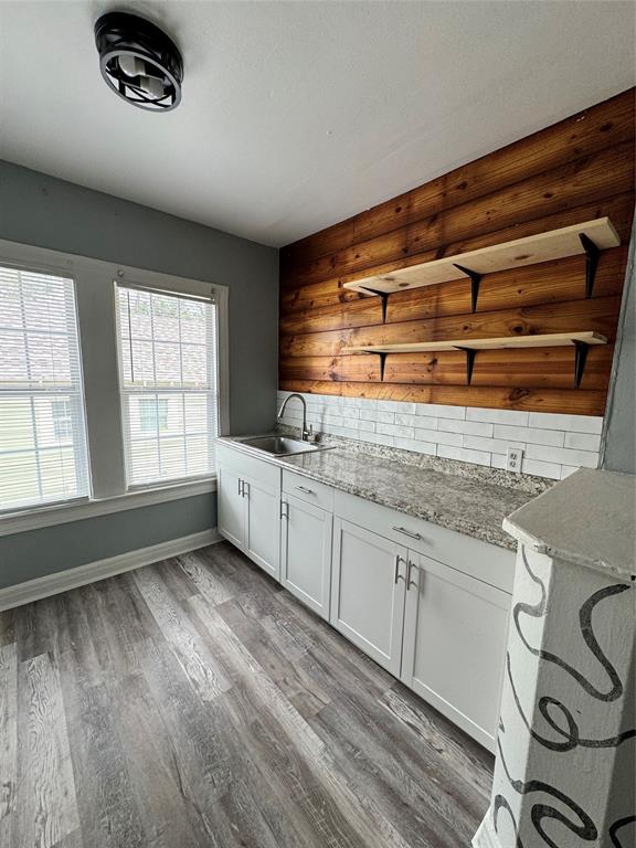 a kitchen with a sink and cabinets