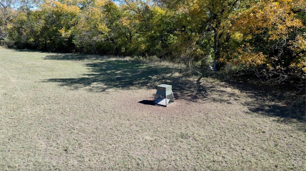 a view of backyard with table and chair