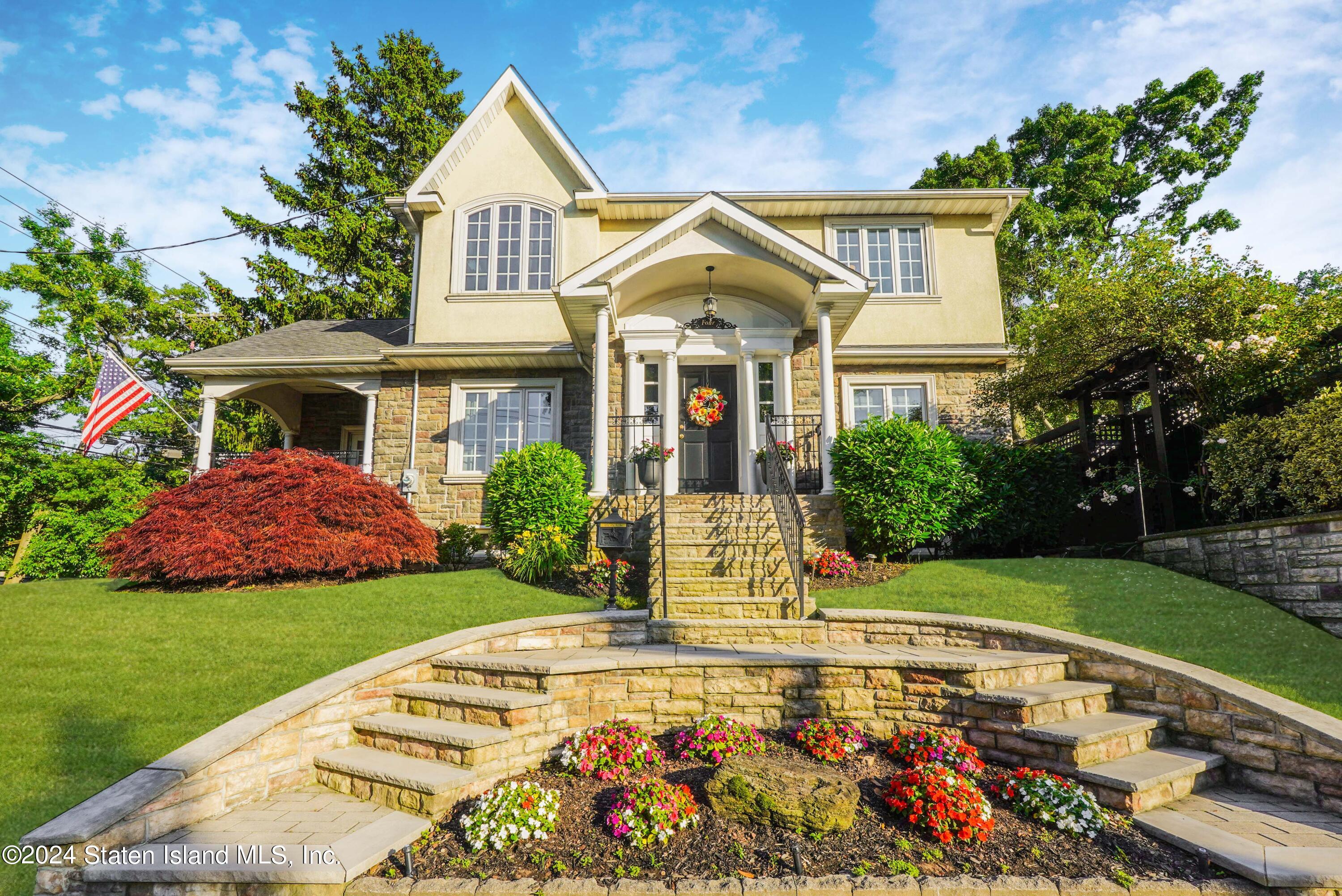 a front view of a house with garden