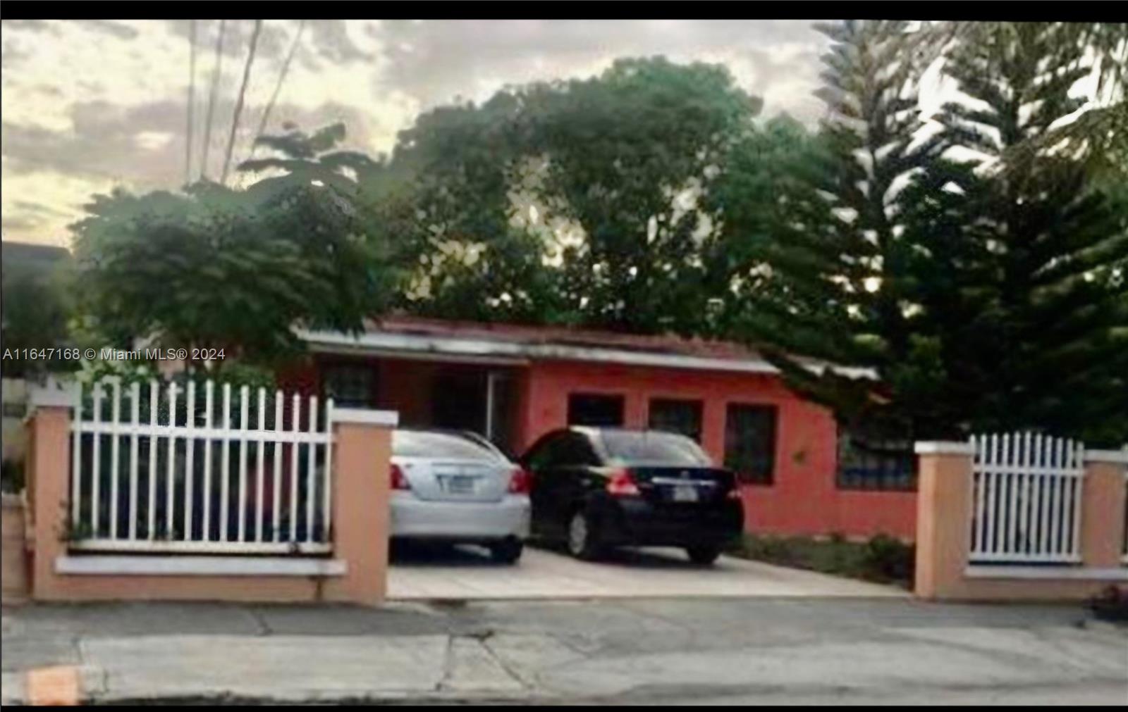 a view of a car parked in front of a house