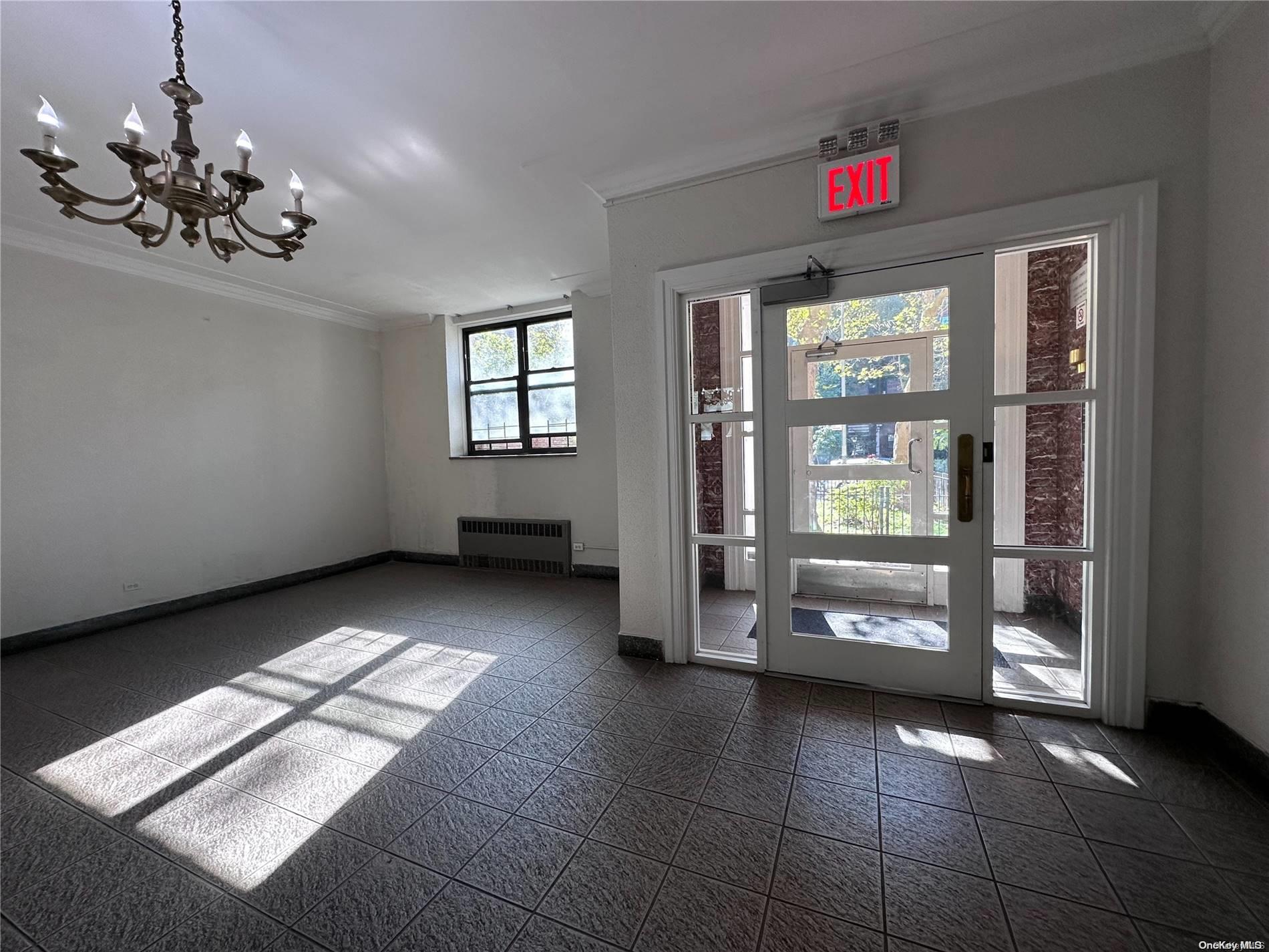 a view of an empty room with a window