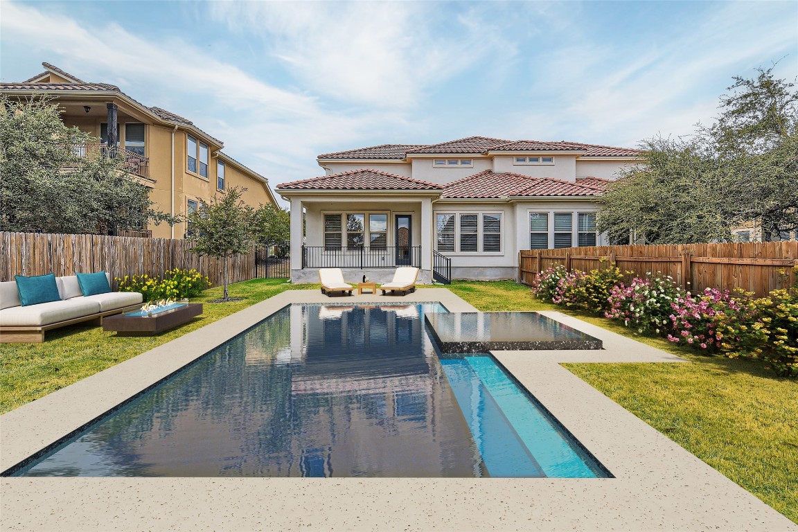 a view of a house with swimming pool and sitting area