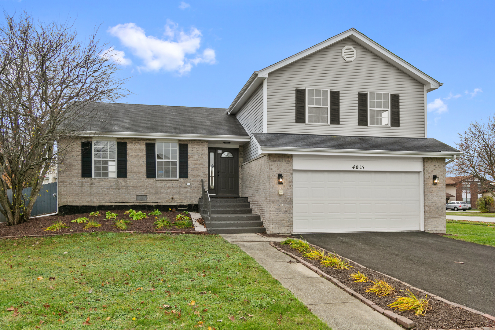 a front view of a house with a yard