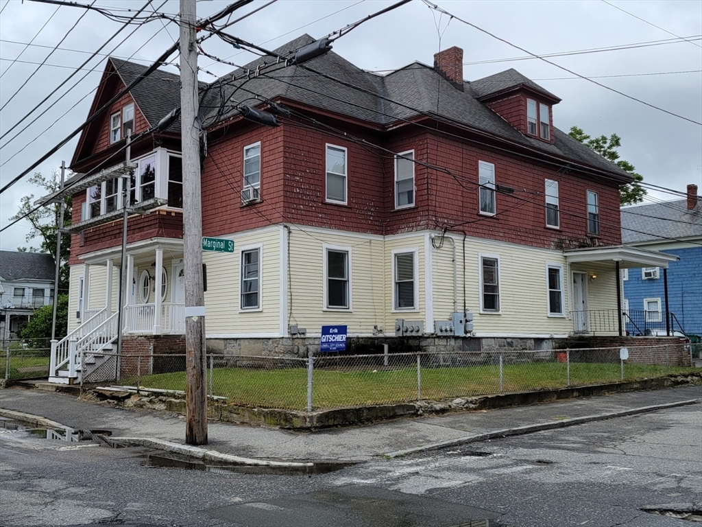 front view of house with a small yard