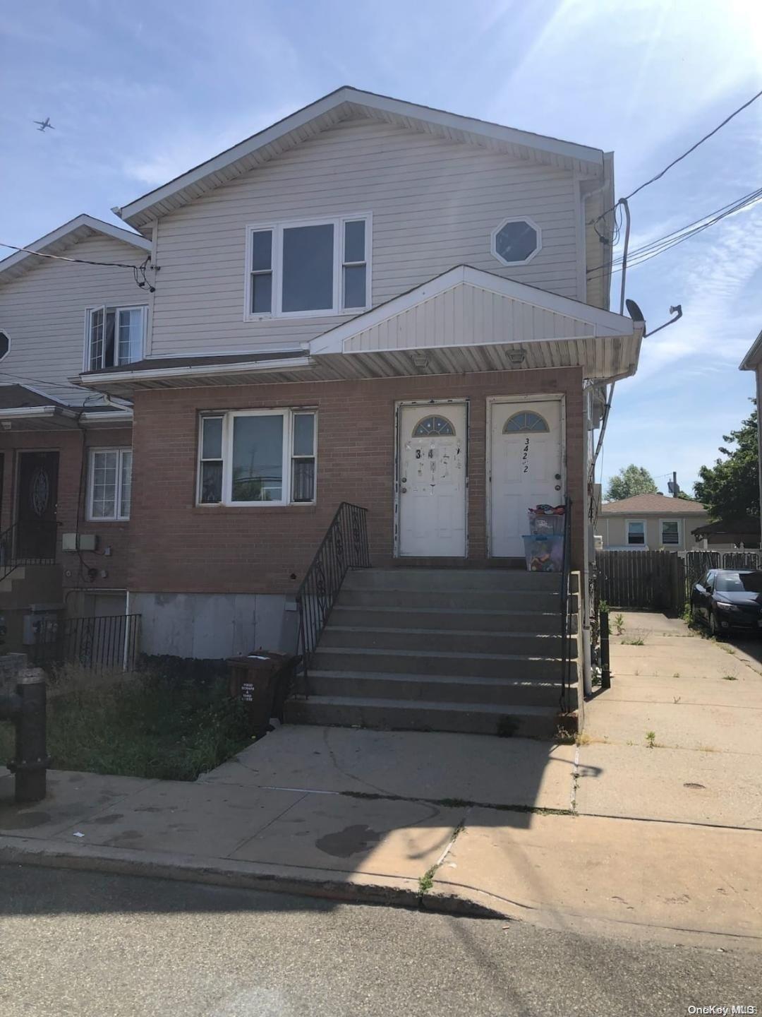 a front view of a house with garage