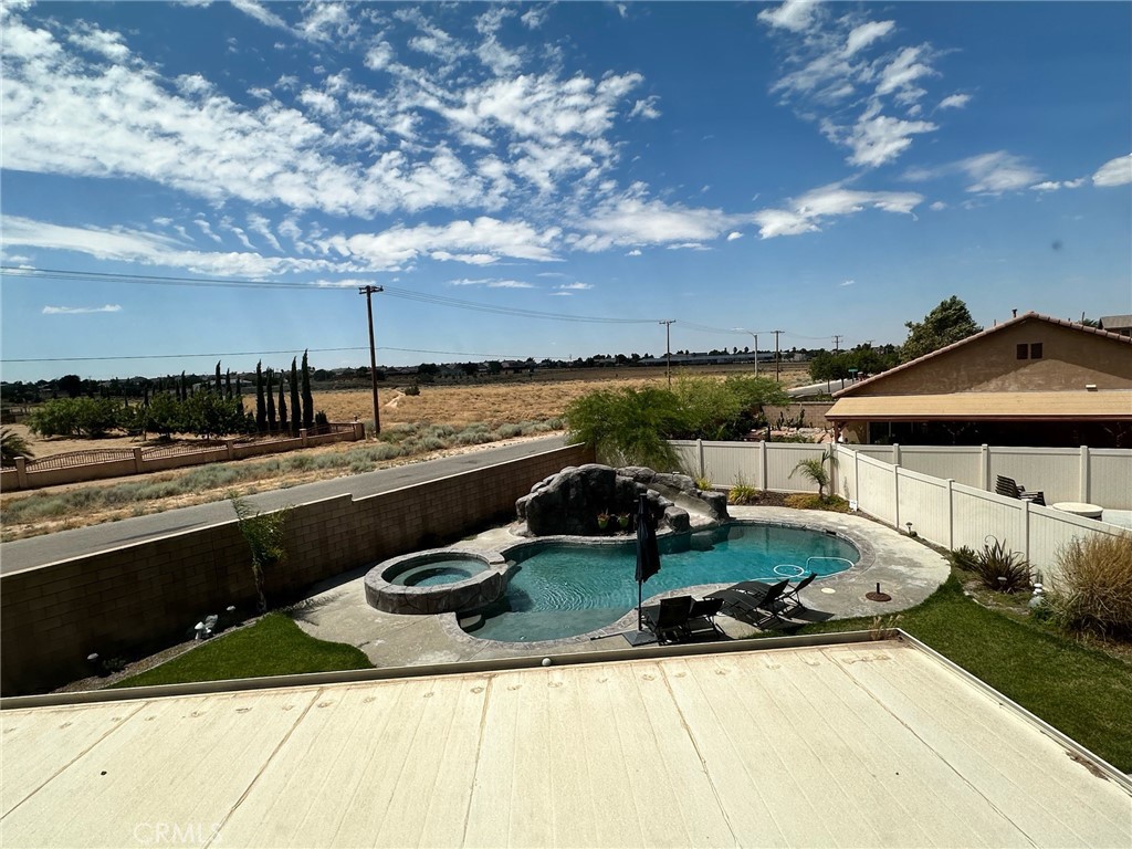 a view of a swimming pool with a lounge chairs