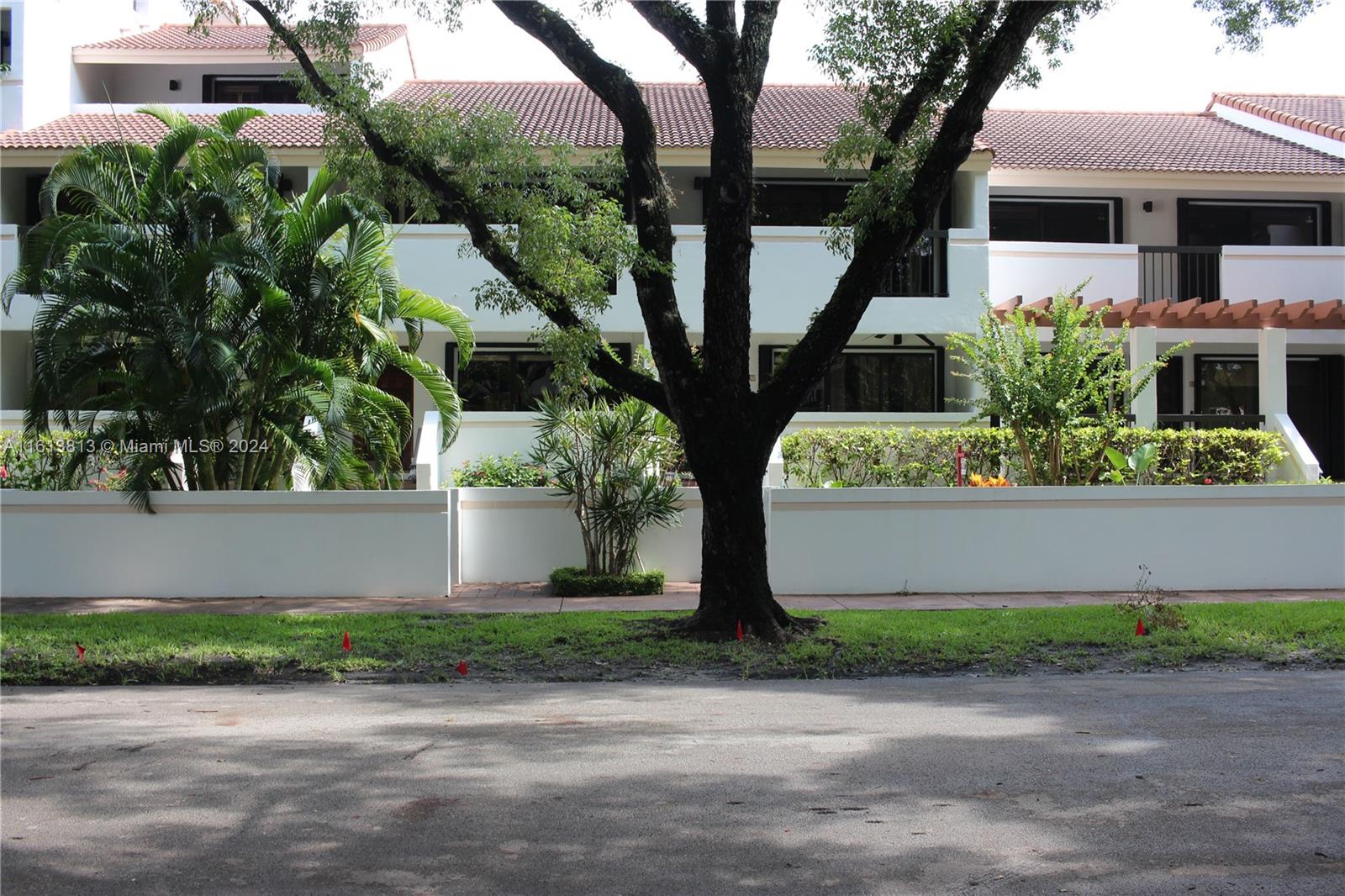 a front view of a house with a yard and a garage