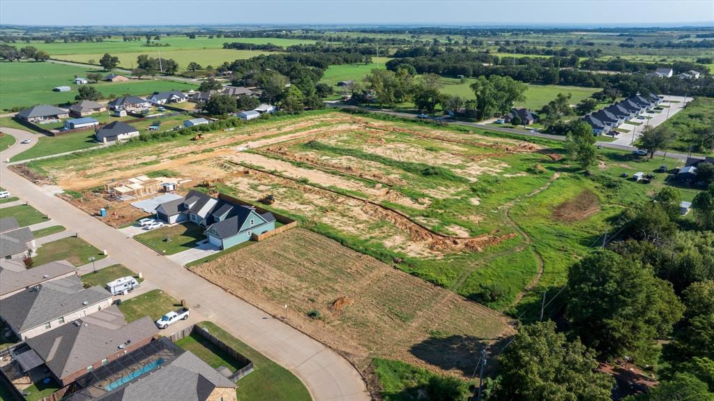 an aerial view of a residential houses with outdoor space