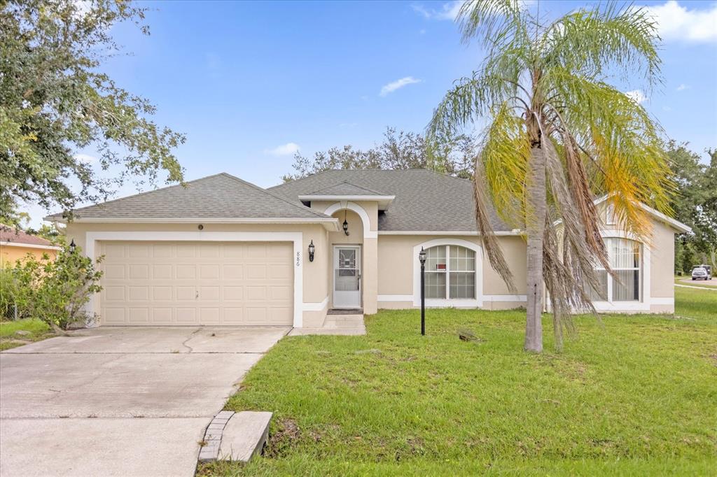 front view of a house with a yard