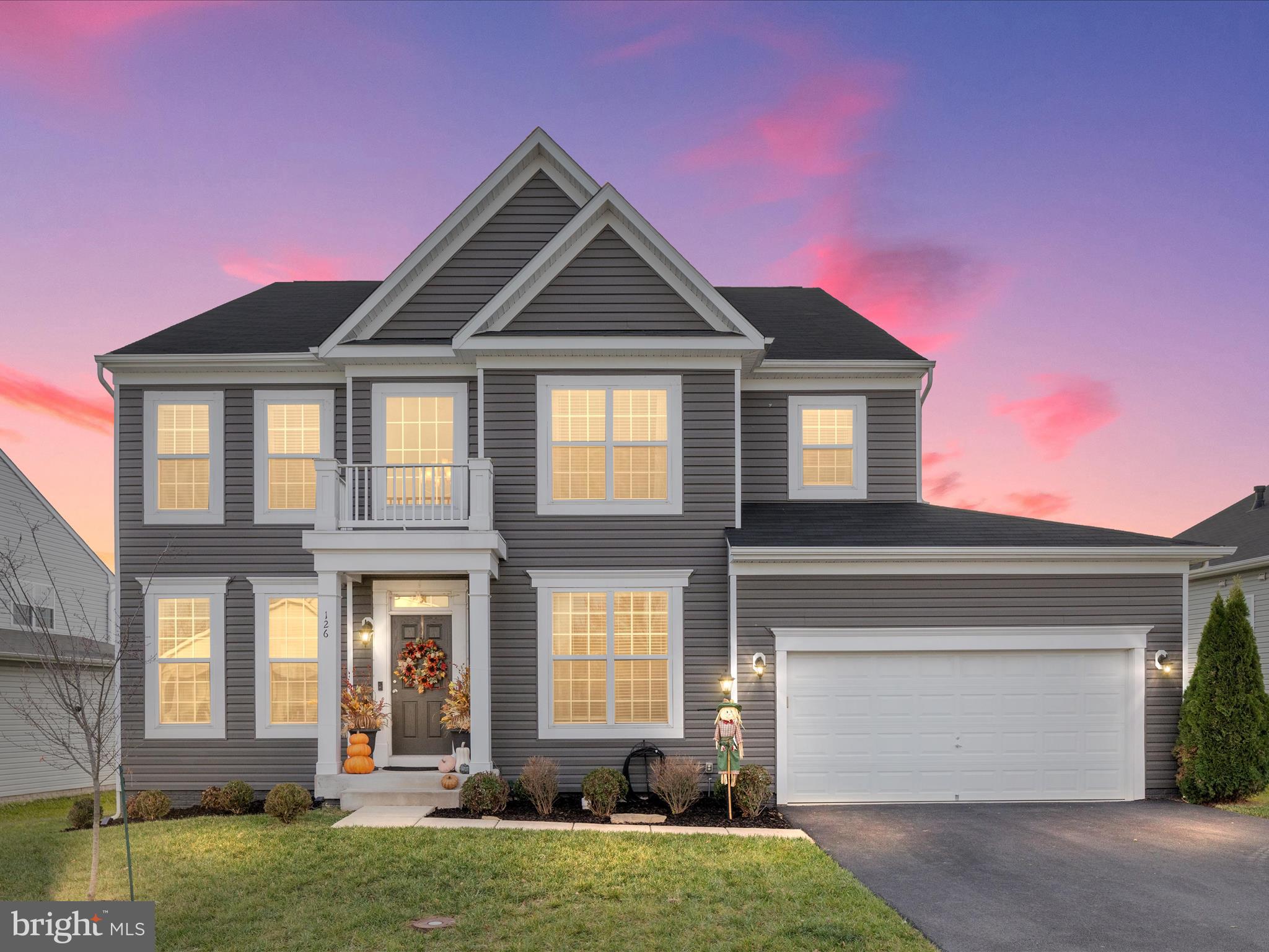 a front view of a house with a yard