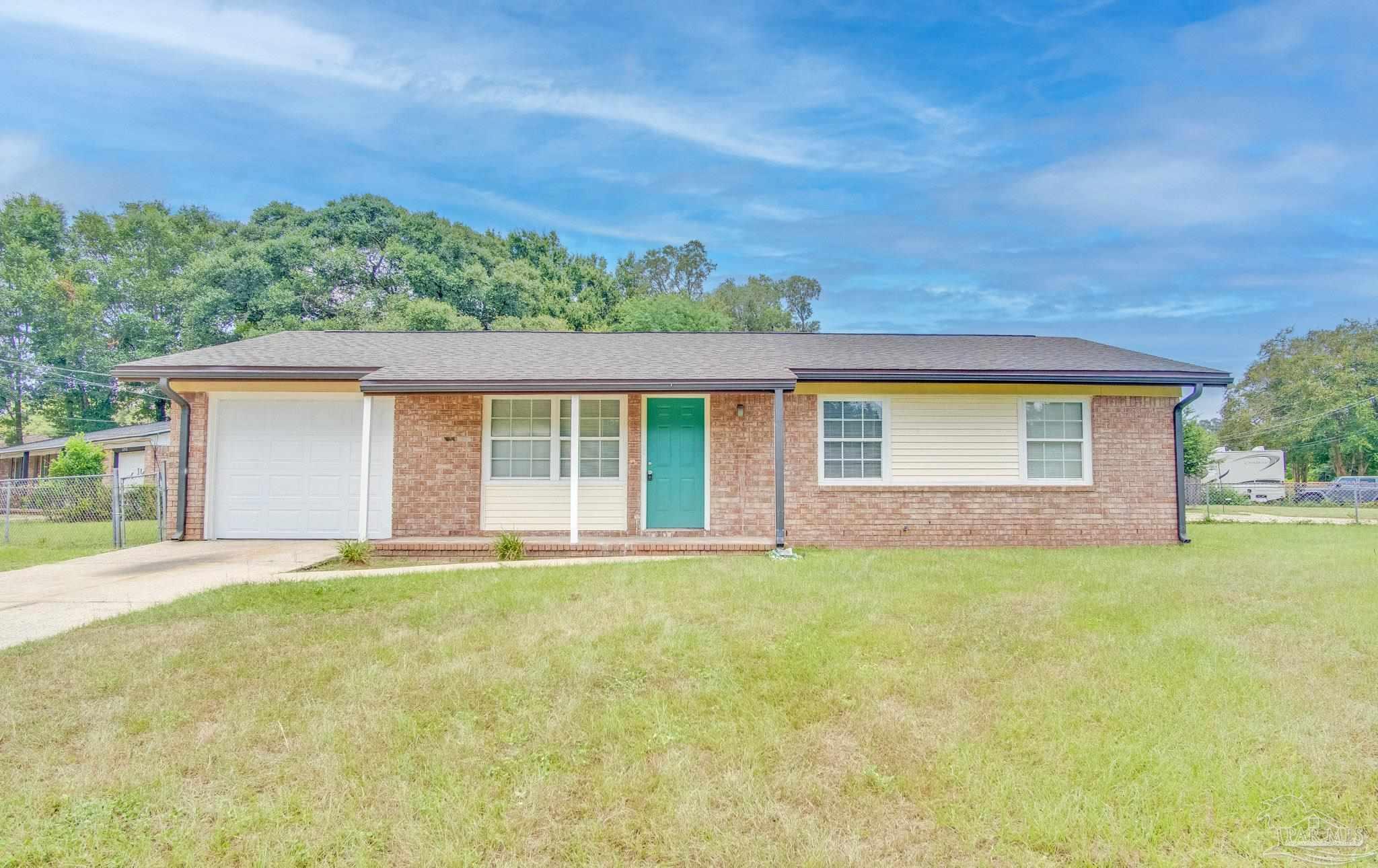 front view of a house with a yard