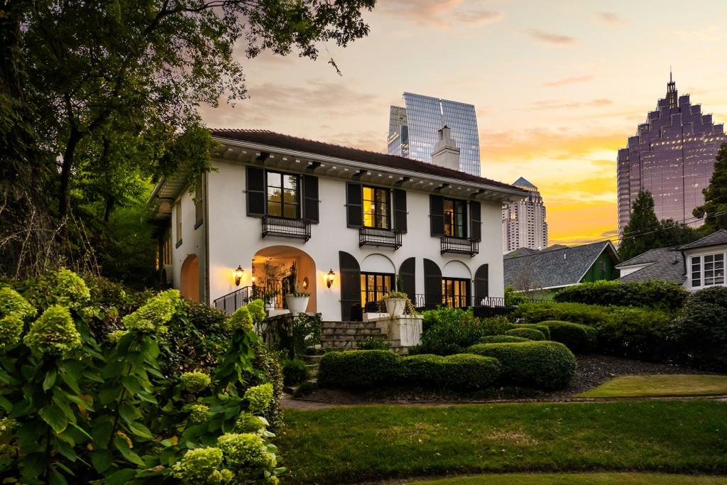 a front view of a house with garden