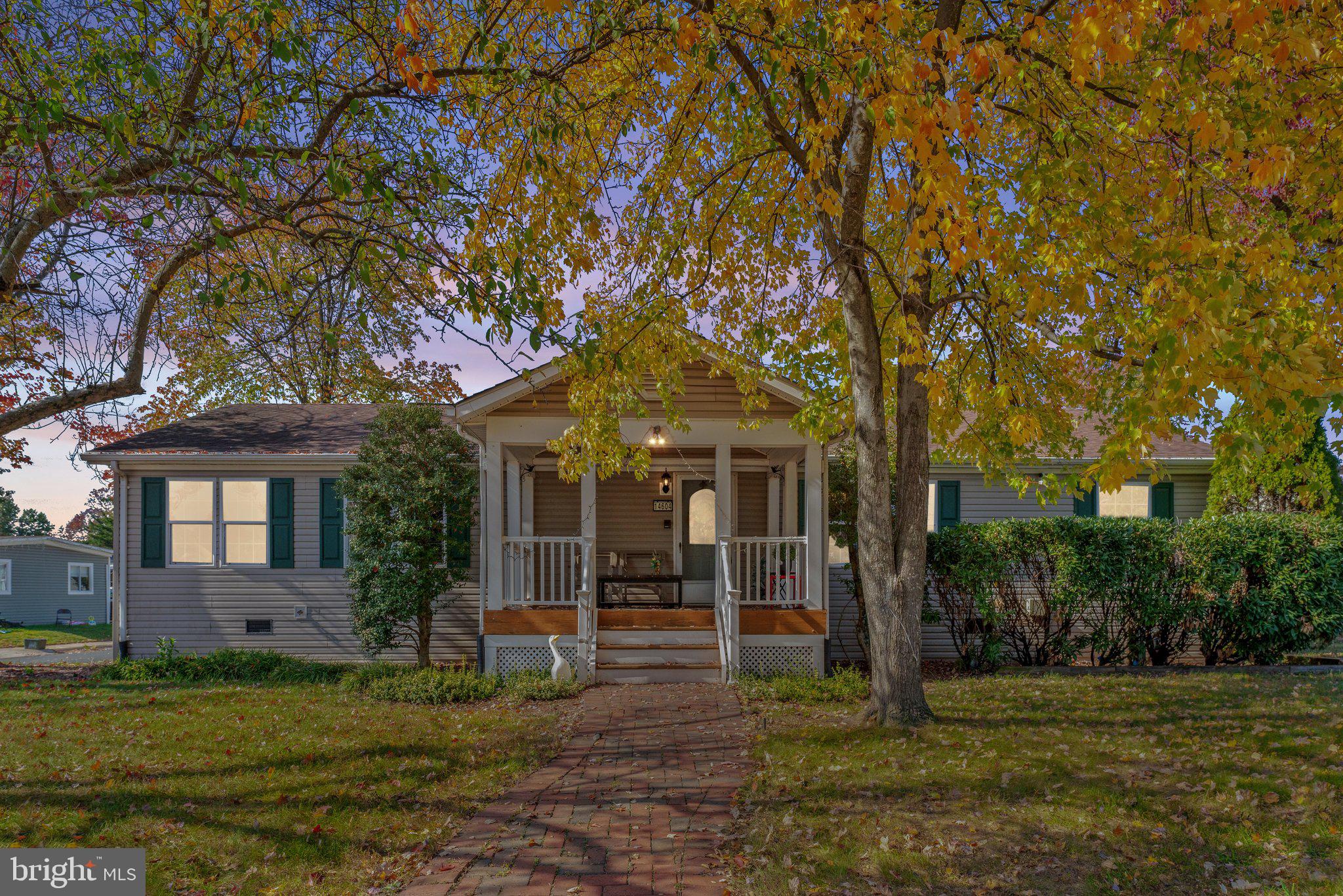 front view of a house with a tree