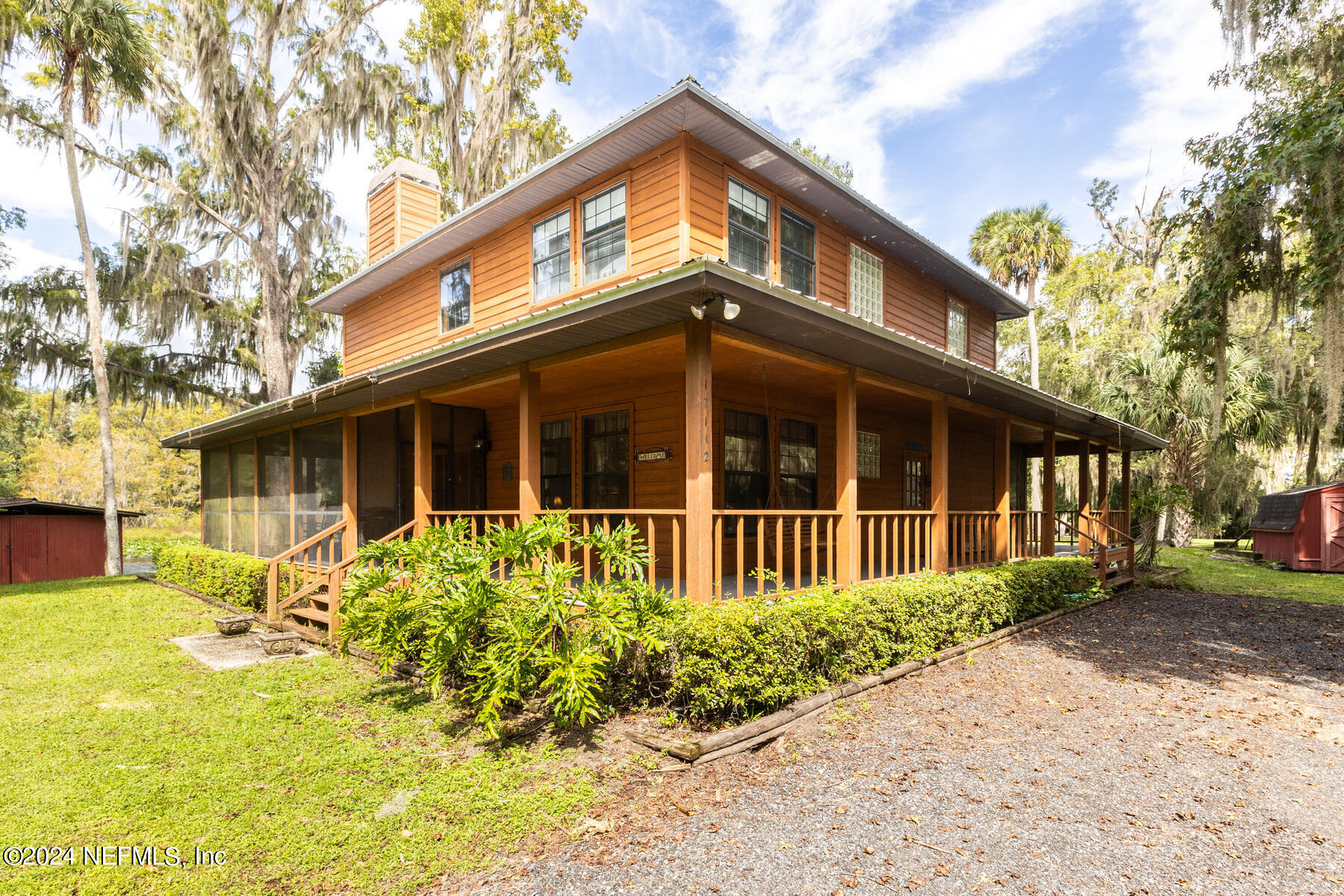 a view of house with yard