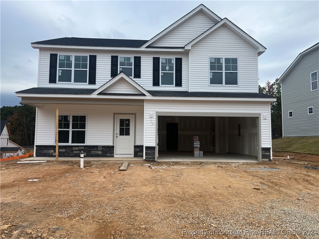 a front view of a house with yard