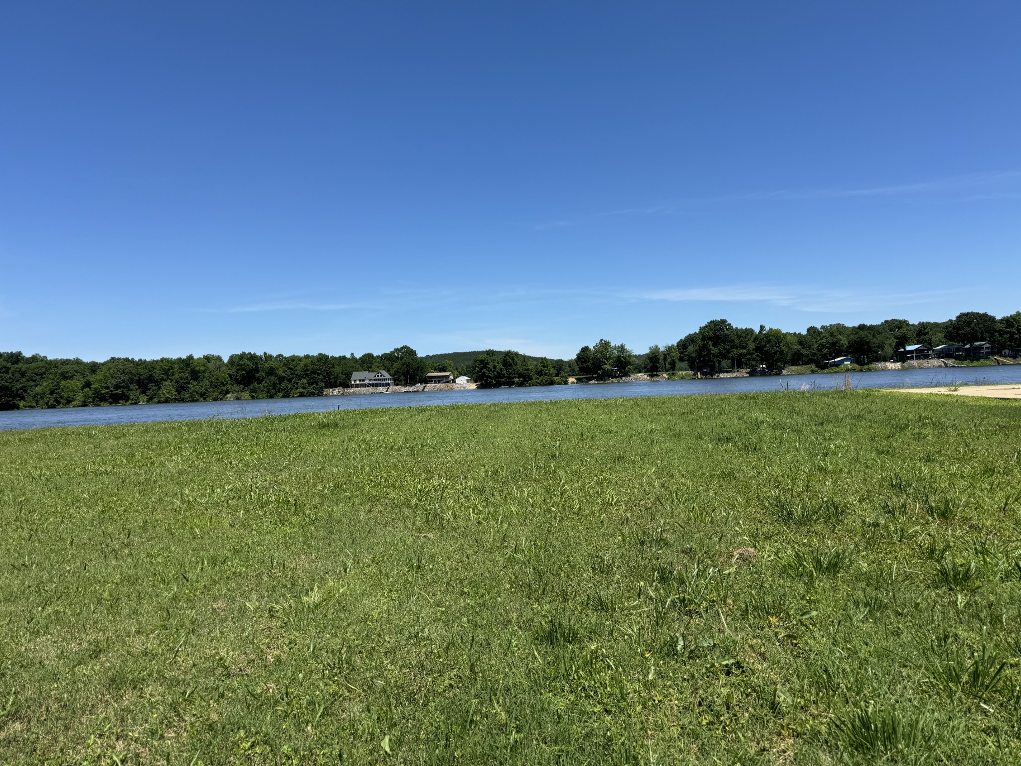 a view of a lake and a yard