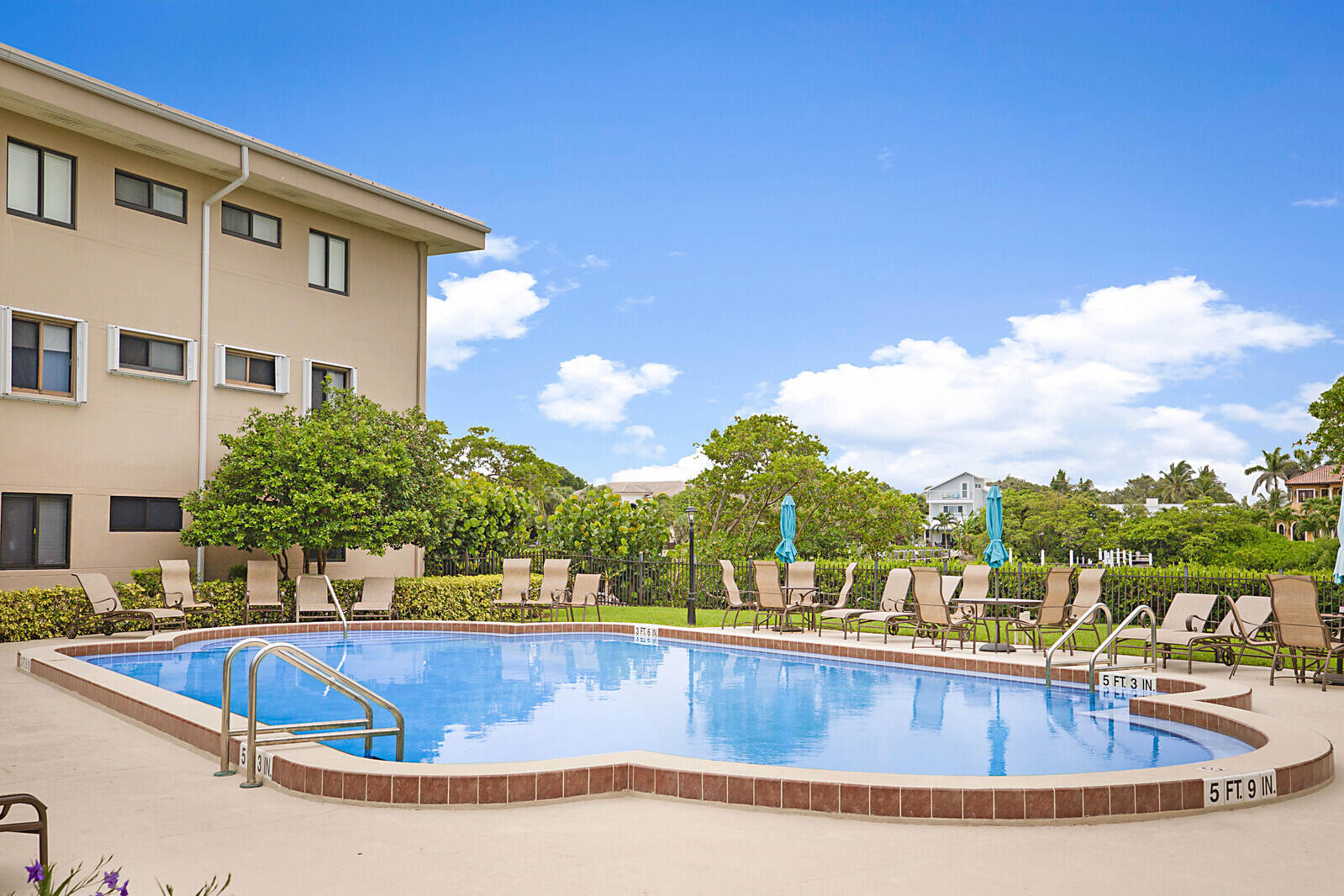 a view of a swimming pool with a chairs