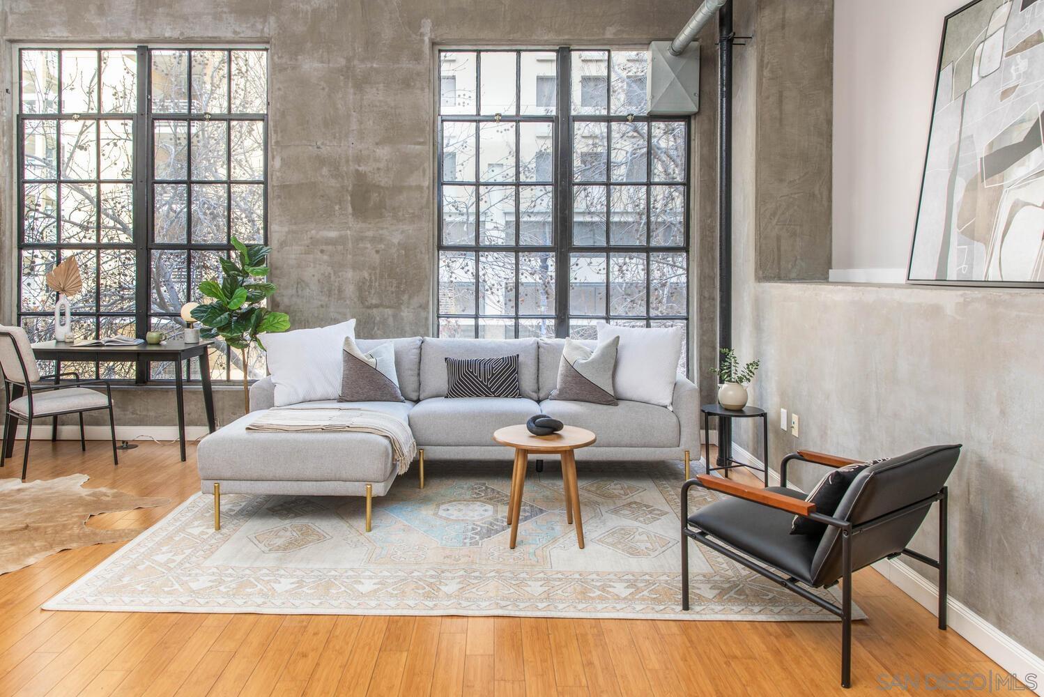 a living room with furniture and a large window