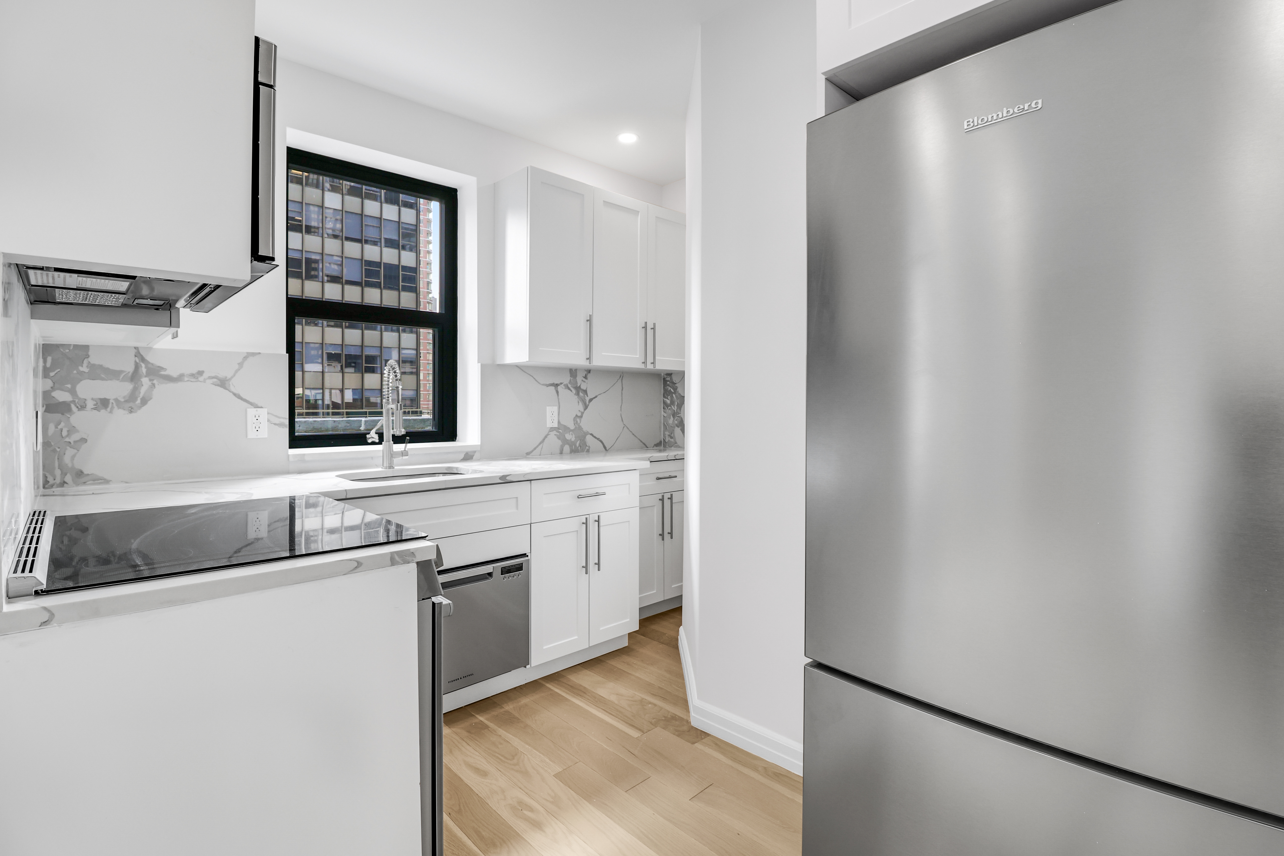 a kitchen with a sink and a refrigerator