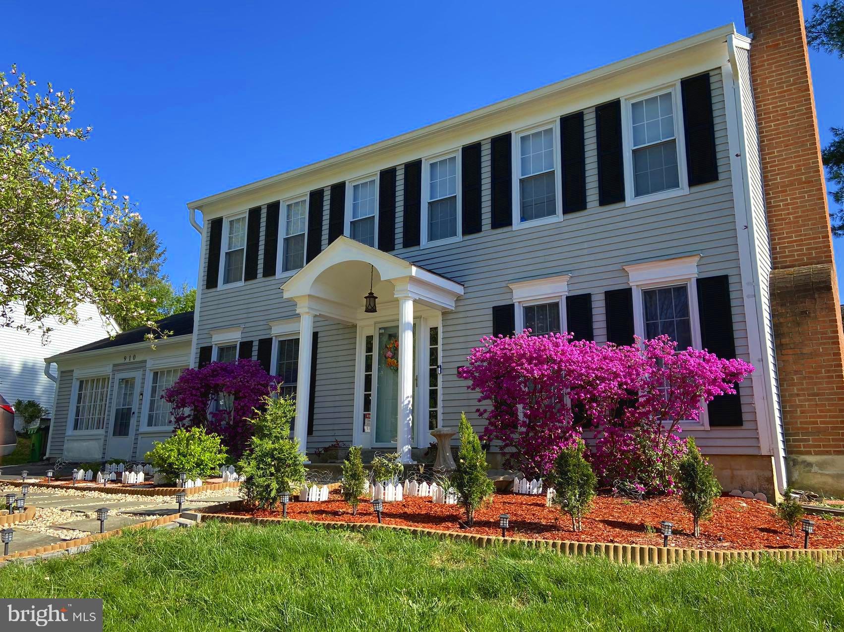 a front view of house and yard with green space