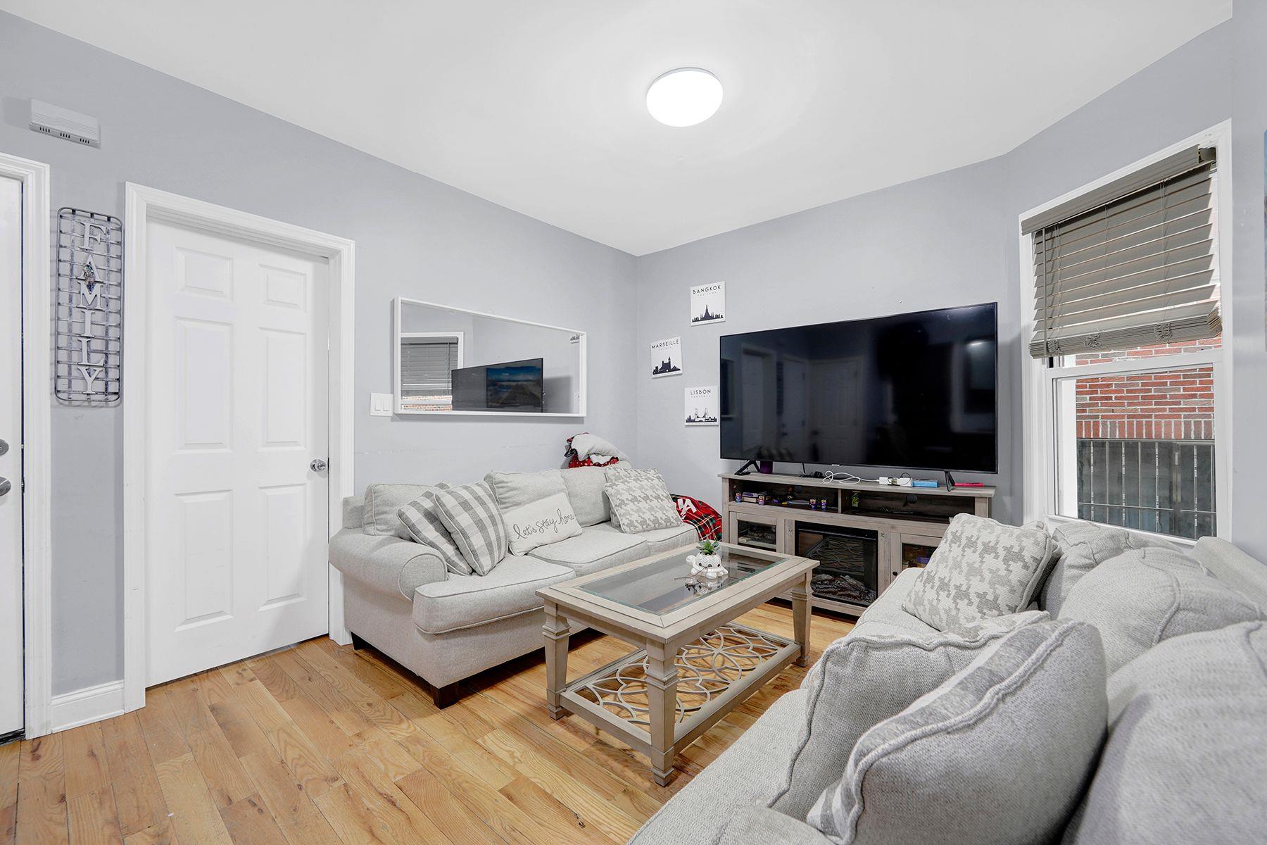 Living room featuring a fireplace and hardwood / wood-style flooring