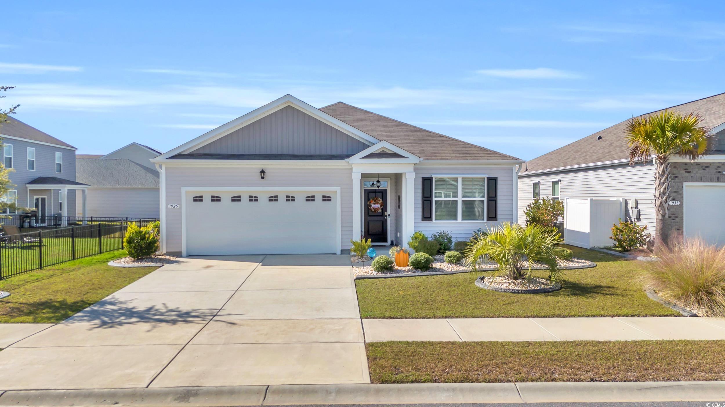 View of front of home featuring a garage and a fro