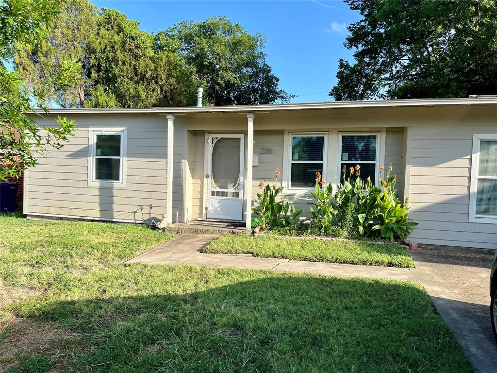 front view of a house with a yard