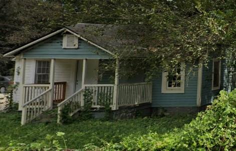 a front view of a house with yard