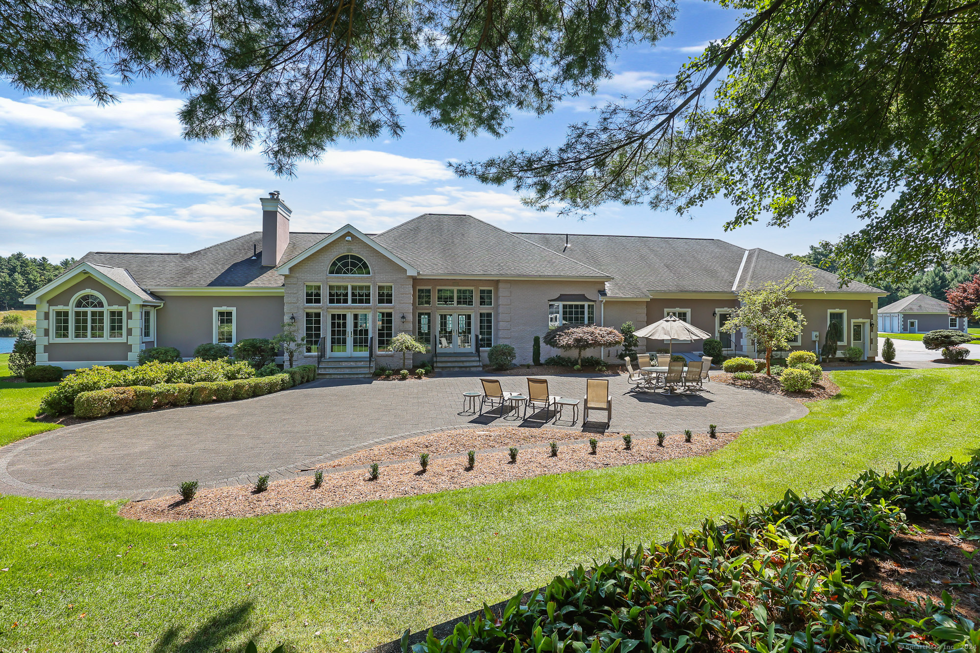 a front view of house with yard and seating area