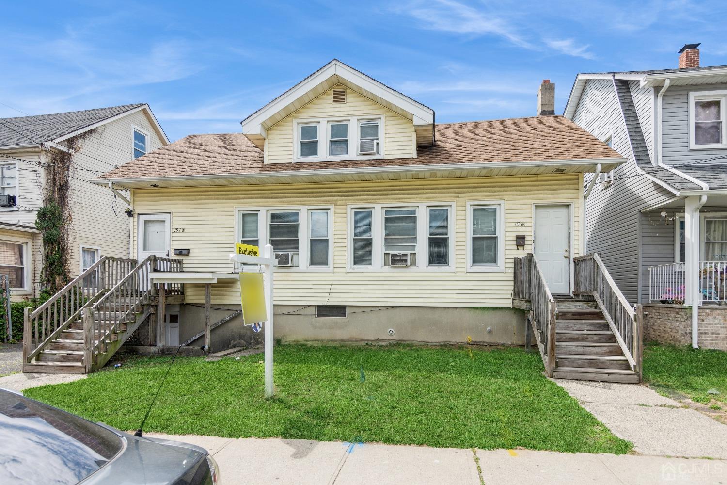 a front view of a house with a yard