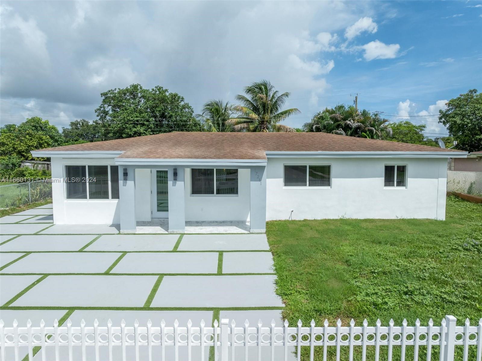 a house with yard in front of it