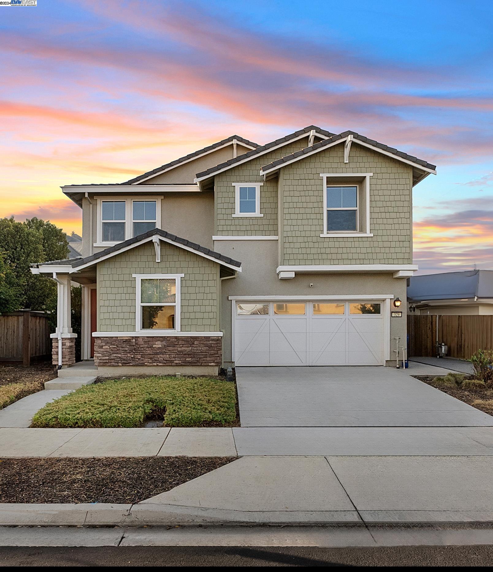 a front view of a house with a garage