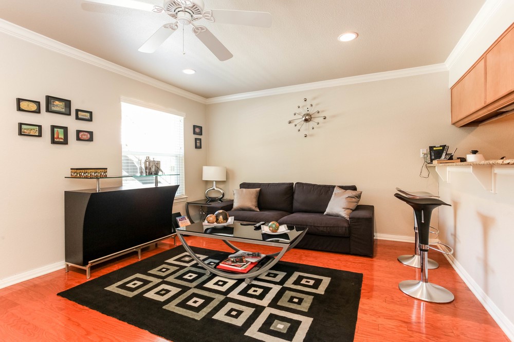 a living room with furniture and a flat screen tv