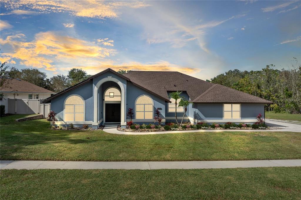 a front view of a house with a yard