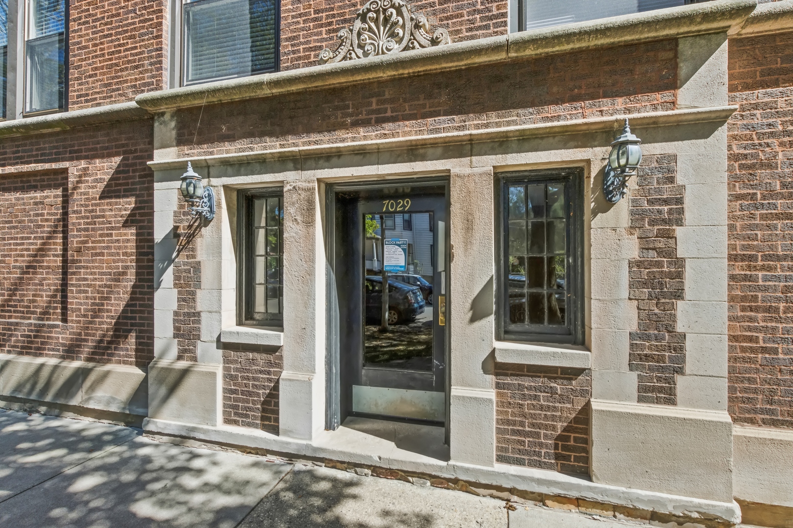 a view of a brick house with a large window