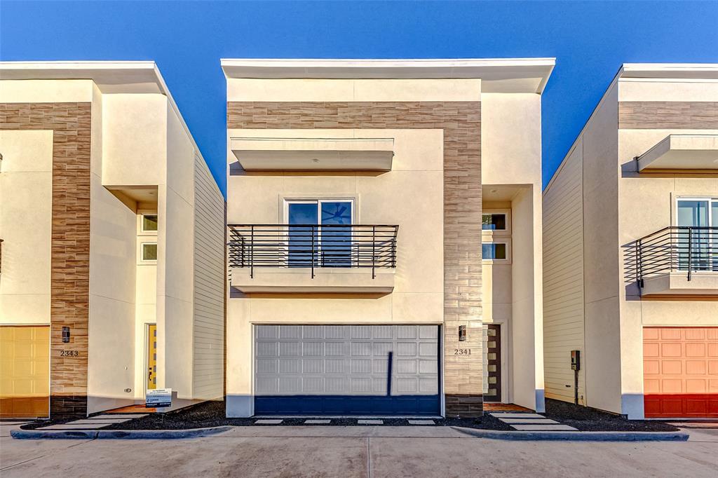 a front view of a house with a garage