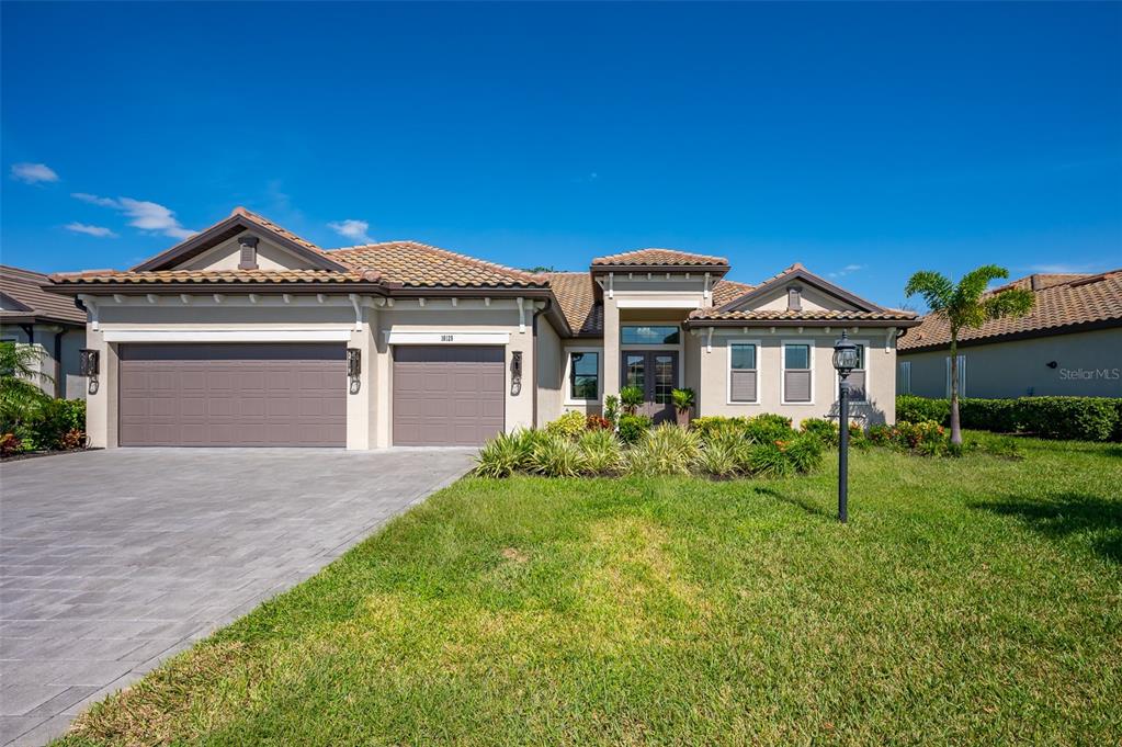 a front view of a house with a yard