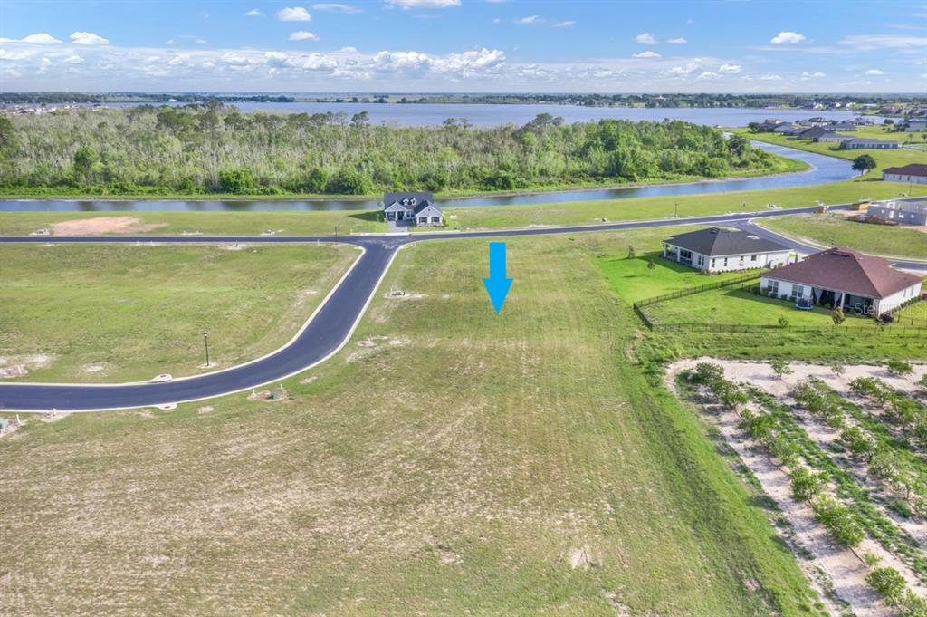 a view of a lake with a big yard