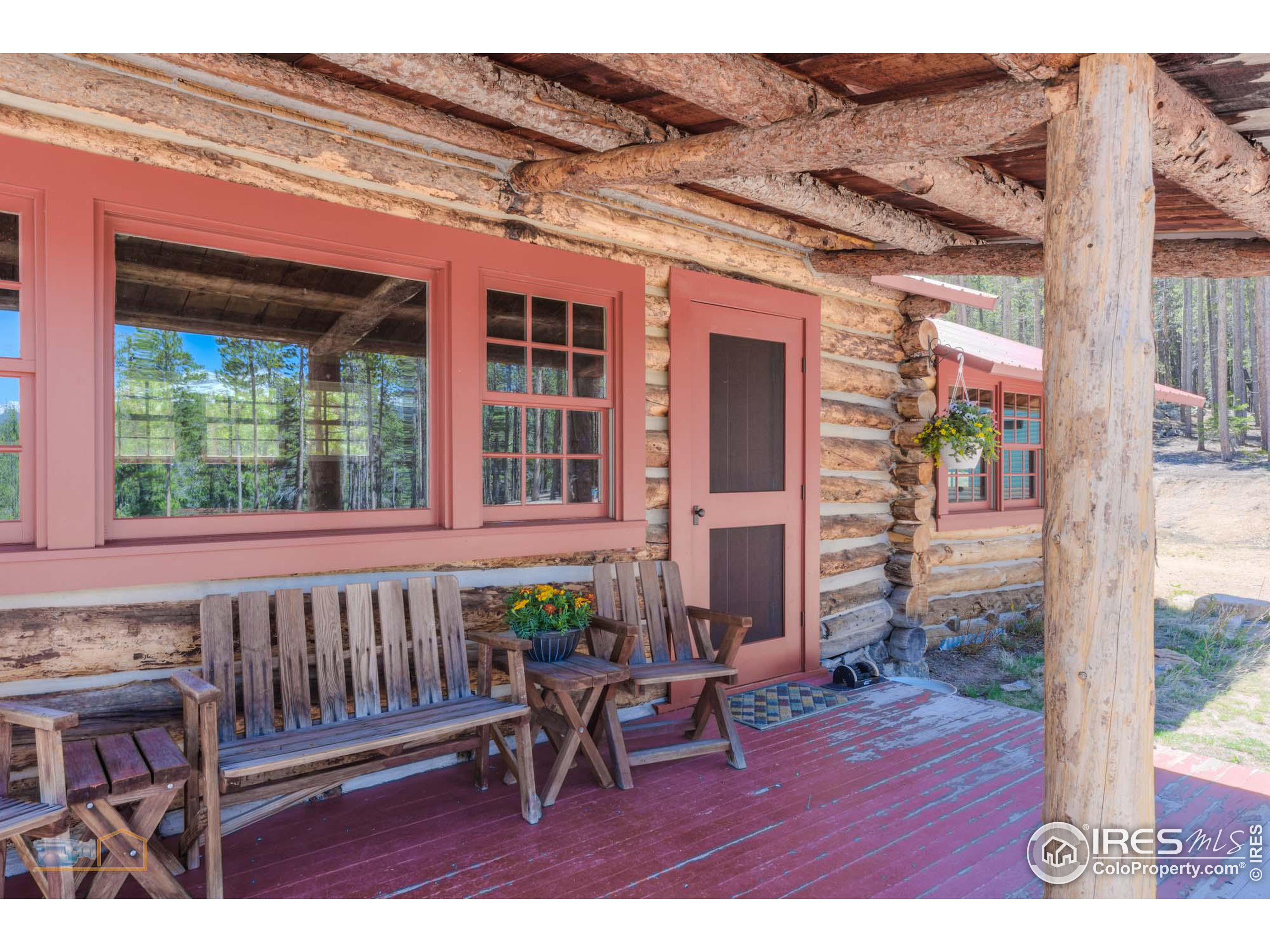 a view of a porch with a table and chairs